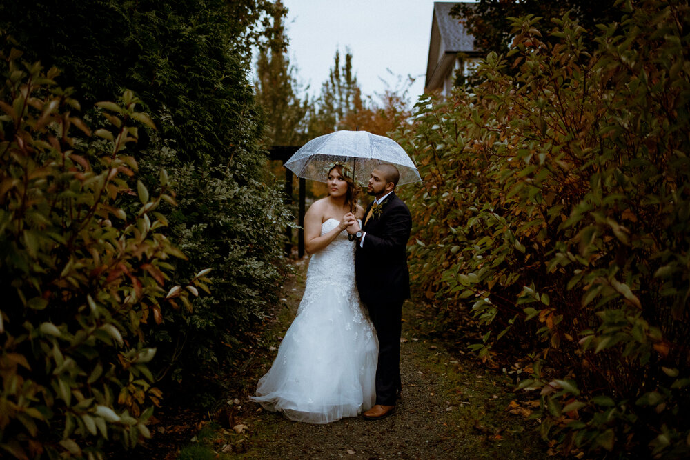 A moody and stylish photo of a bride and groom at their South Bonson Community Centre wedding in Pitt Meadows.