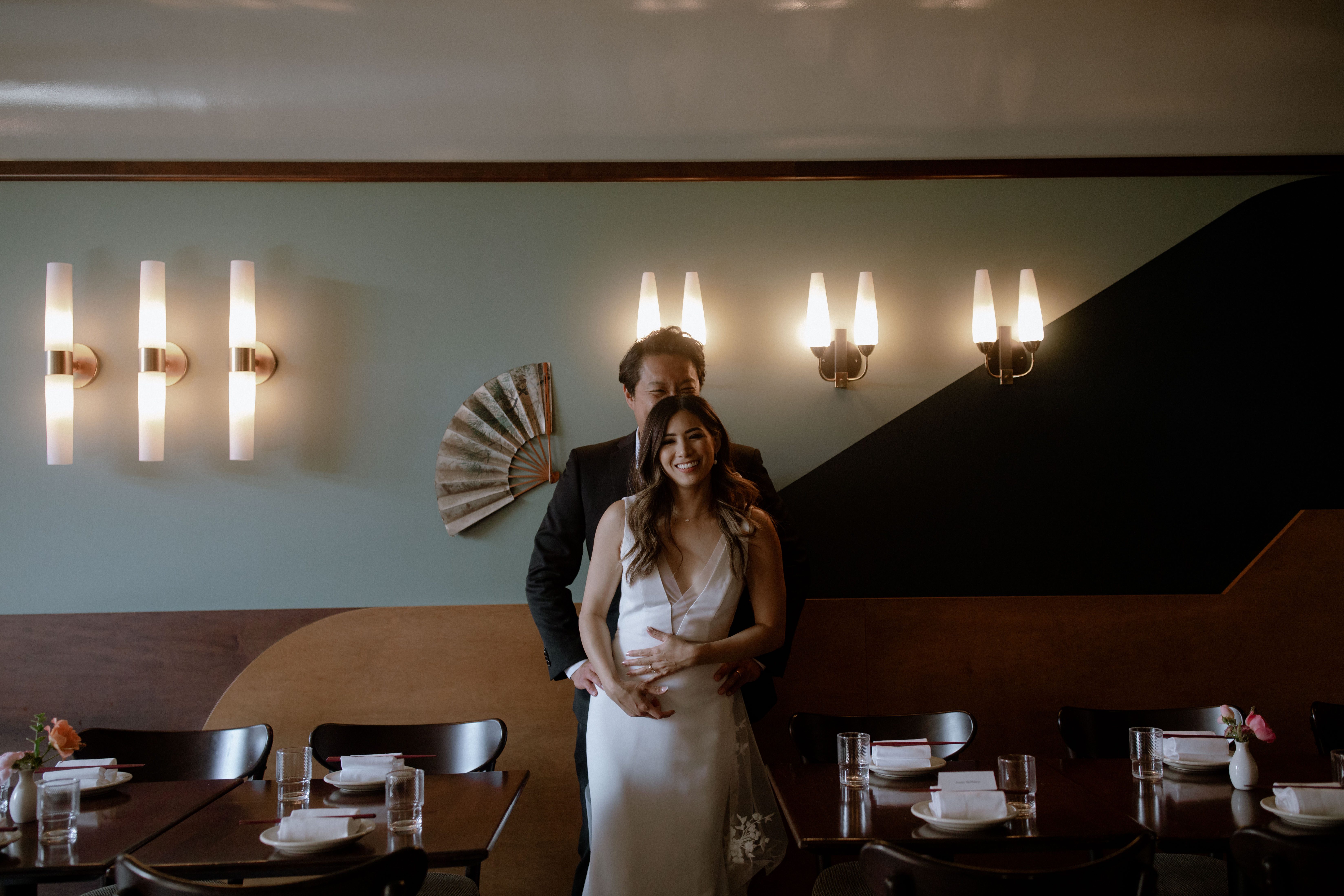 Wedding couple posing inside Kissa Tanto in Chinatown, Vancouver