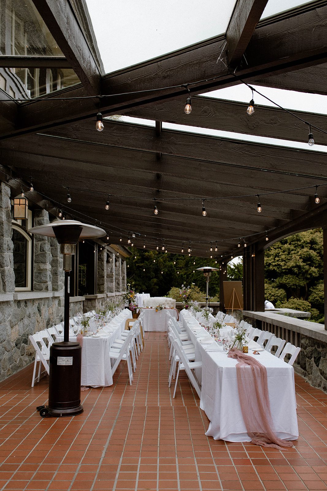 Tablescape with pink cheesecloth table runners at an elegant garden themed wedding in Cecil Green Park House.
